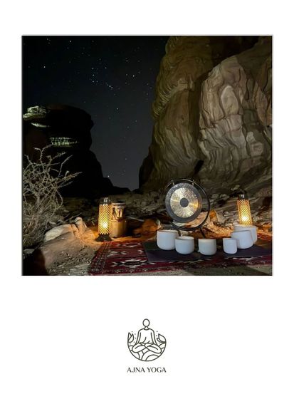 A setup for a night-time sound healing session under the starry Al-Ula sky. The combination of the gong, crystal bowls, and the desert silence is profoundly powerful.