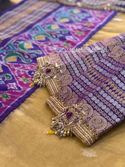 A unique sleeve design combining brocade with heavy zardosi work.