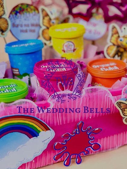 Another look at our "Summer's Here" Holi platter, featuring a rainbow cutout and butterfly decorations for a cheerful vibe.