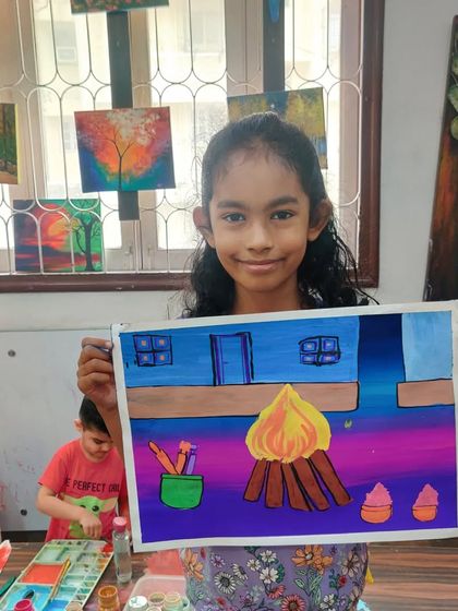 This student's Holika Dahan painting includes wonderful details like a bucket of colours and a pichkari, telling the full story of Holi.