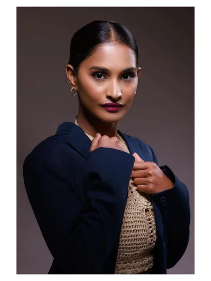 A strong, direct-to-camera look that is both engaging and professional.