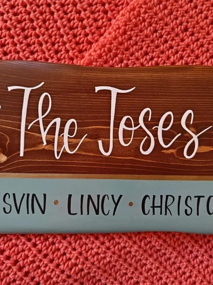 The rich brown stain on this pine wood plaque for "The Joses" allows the natural grain to shine through, complemented by the elegant white lettering and teal accent.