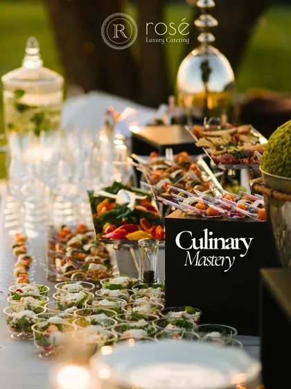 An outdoor appetizer station showcasing our culinary mastery. From fresh salads in individual cups to colorful skewers, every dish is crafted from the freshest and most exquisite ingredients.