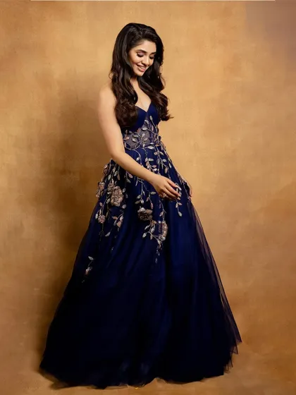 I styled the lovely Krithi Shetty for the Galatta awards in Chennai. This strapless navy blue tulle gown with floral embroidery creates a fairytale moment, perfect for a grand awards night.