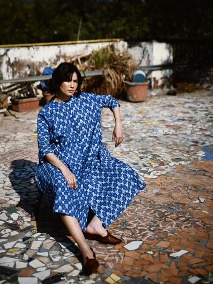 An outdoor shot for House of Wandering Silk on a mosaic rooftop. The natural light and interesting location add character to the fashion story.