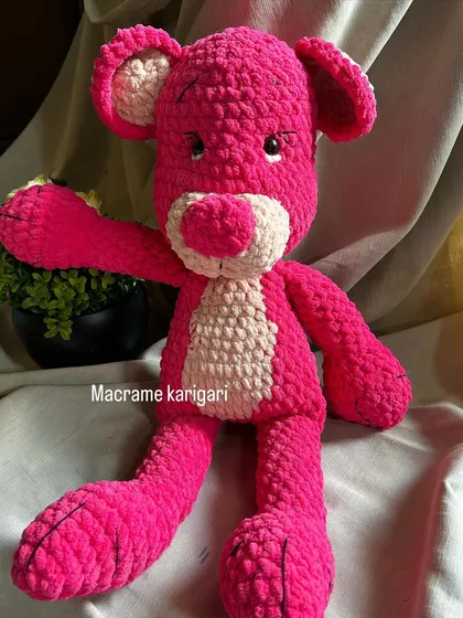 Our version of the classic Pink Panther, handcrafted from chunky pink yarn. This large plush toy is perfect for fans of the iconic character.