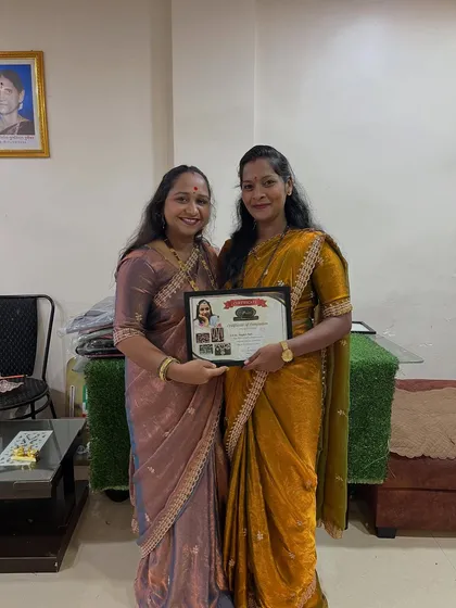 Presenting a certificate to a talented student. It is my goal to empower women to become financially independent through this beautiful art form.