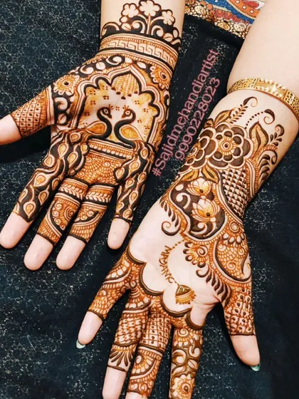 This back-hand design features elegant peacocks at the wrist and a beautiful floral pattern on the other hand. The mix of styles shows how I can customize designs for a unique look.