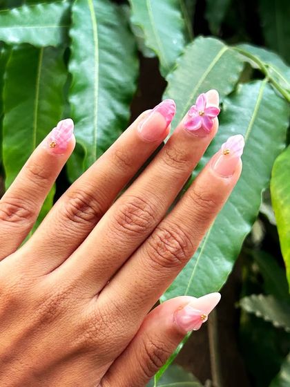 Another angle of the 3D floral summer nails, showcasing the full hand.