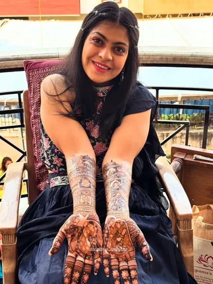 A happy bride showing off her full bridal mehandi. It was a joy to create this design for her special day.