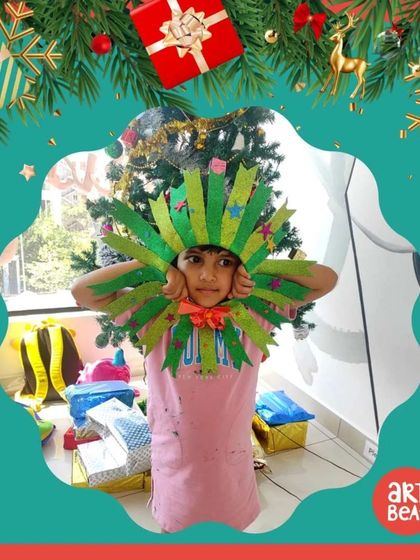 A student shows off the festive headgear she made during our Christmas Art Party. We love seeing the kids get creative with their holiday themed crafts.