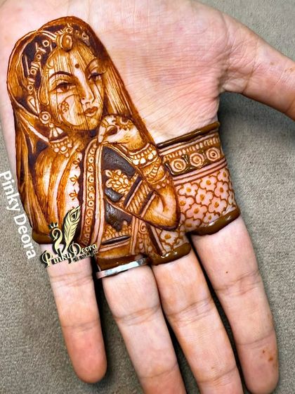 The nearly complete portrait on the palm, with a decorative border starting to form.