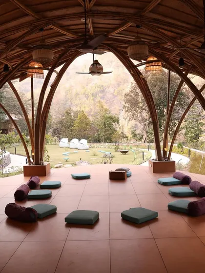 The beautiful shala at Oneness Rishikesh, set up for our closing ceremony. This space, with its natural architecture, becomes a sanctuary for our community to gather, share, and celebrate.