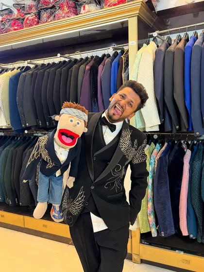 Having some fun while trying on new suits. Bunny loves the camera.