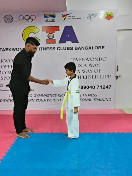 A handshake for a new yellow belt.