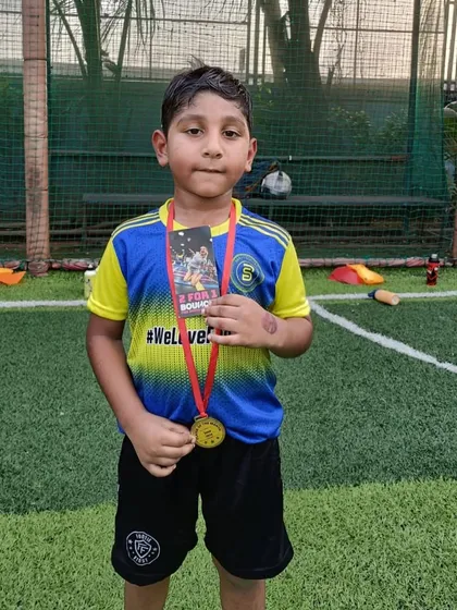 A proud Player of the Month, recognized for his hard work and dedication.