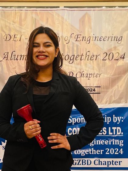 Posing with my award at the DEI Alumni Meet 2024. It was a well-organized and memorable event.