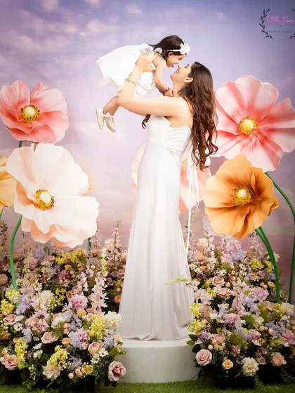 There is no bond like the one between a mother and her child. For this Mother's Day mini-session, I created a floral wonderland with giant paper flowers to capture this pure, uplifting love. These are the moments that fill your heart and your walls.