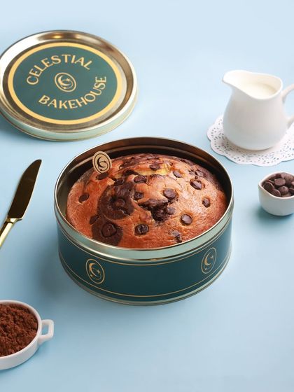 A closer look at our Marvel Marble Cake, studded with chocolate chips and baked to perfection. It's shown here in our reusable Cosmic Tin, a perfect way to store and serve.
