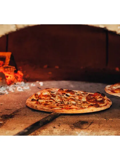 A rustic, thin-crust pizza baking to perfection in a traditional wood-fired oven. We bring this authentic Italian experience to your event, offering a live pizza station that delights guests of all ages with its classic flavors and interactive nature.