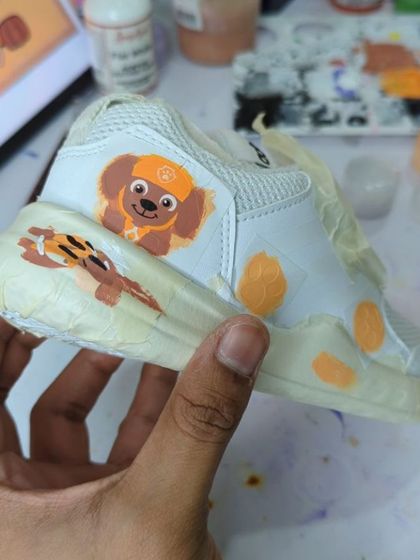A work-in-progress shot from a massive project: 70 pairs of Paw Patrol customs in 7 days. This shows the painting of Zuma.