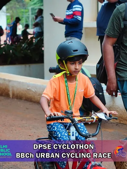 A young participant navigates the course at the DPSE Cyclothon. Safety is my top priority, with helmets being mandatory for all riders in every category.