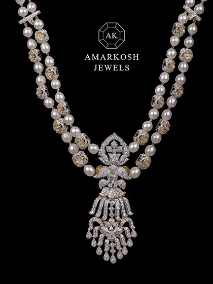Complete your bridal glow with this statement necklace adorned with diamonds and pearls. It's the perfect finishing touch for your big day.