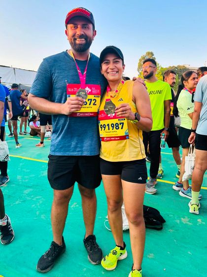 Another happy moment with a running buddy after the TCS10K. The support we give each other is what makes our community so strong.