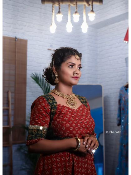 A thoughtful, looking-away pose that creates a sense of story and introspection in this traditional portrait.