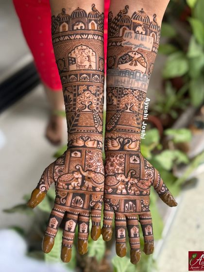 The same personalized quote mehendi, shown with the henna paste still on, highlighting the clean and precise application.