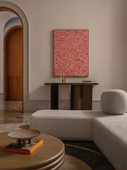 A detail shot of our 'Dash and Dot' console, paired with a vibrant piece of art. The console's simple form and intricate joinery make it a versatile piece that can stand alone or serve as a canvas for other objects.