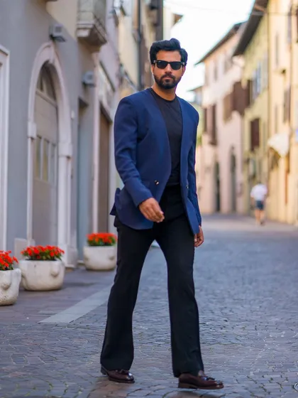 Our lapel-free luxe double-breasted blazer in navy. This modern, minimalist design is perfect for summer events and travel, offering a unique take on classic tailoring.