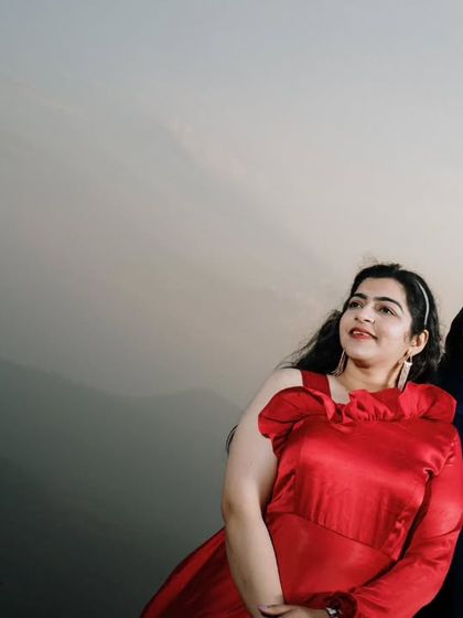 A close-up portrait with the rolling hills providing a beautiful, soft-focus background. This shot emphasizes the couple's connection while still incorporating the natural scenery.