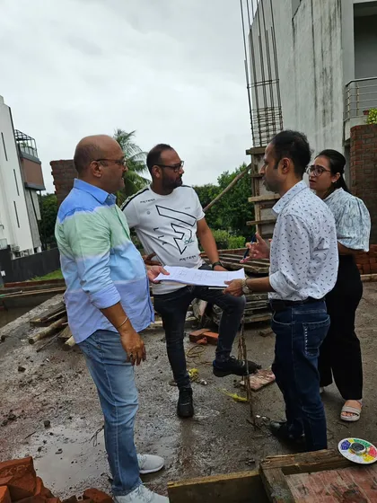 A group discussion on-site with the client and their architect. Teamwork is essential to translate a Vastu plan into a physical reality.