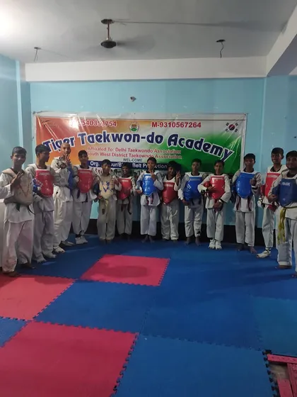 My team of students in their chest guards, ready for a session of fighting practice.