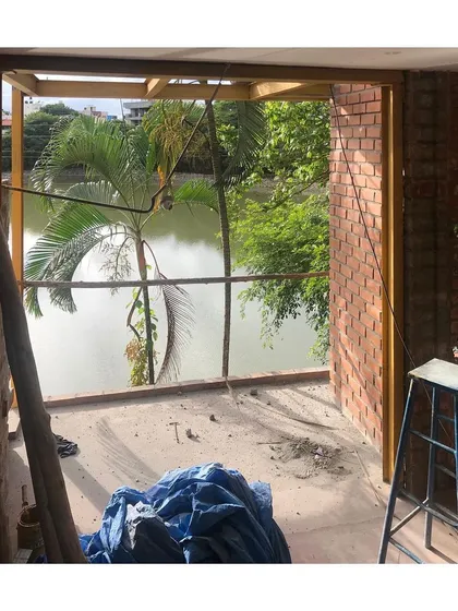 A view from the 'Keremane' lake house project during its construction phase. The design intentionally frames the natural landscape, blurring the line between the indoor living space and the lakeside environment. This highlights my commitment to creating architecture that is deeply connected to its site.
