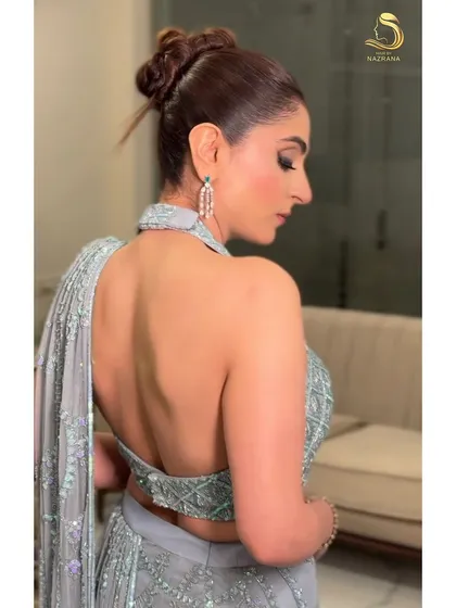 A side profile of the sleek knot bun, showcasing its clean and elegant silhouette.