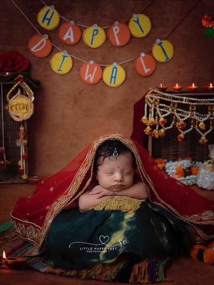 Happy Diwali! This festive setup, with diyas, traditional attire, and a warm glow, is the perfect way to include your newest family member in the festival of lights. It’s a memory that will brighten your home for years to come.