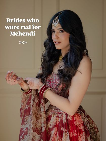 Who says you can't wear red for Mehendi? This bride proves that a bold floral red outfit can be a stunning choice for pre-wedding festivities.
