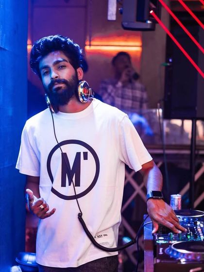 A shot of me at The Fixx Bar, with red laser lights adding to the intensity of the moment.