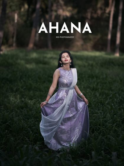 A full-length portrait from the same series, showcasing the entire outfit against the beautiful green backdrop.