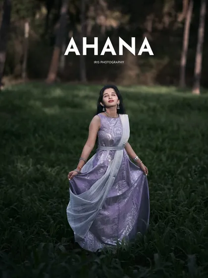 A full-length portrait from the same series, showcasing the entire outfit against the beautiful green backdrop.