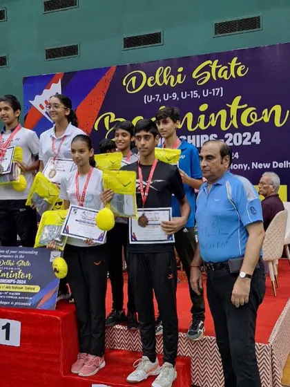 A group of my mixed-category winners at the Delhi State Championships. Training for singles, doubles, and mixed doubles requires a comprehensive skill set, which I focus on developing.