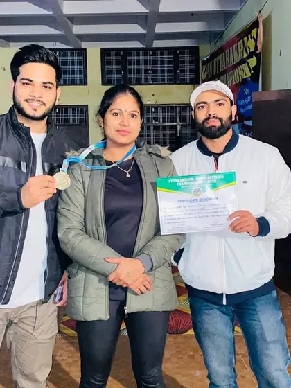 A picture with my coaches after winning at the Uttarakhand powerlifting championship. Their support is the foundation of my success.