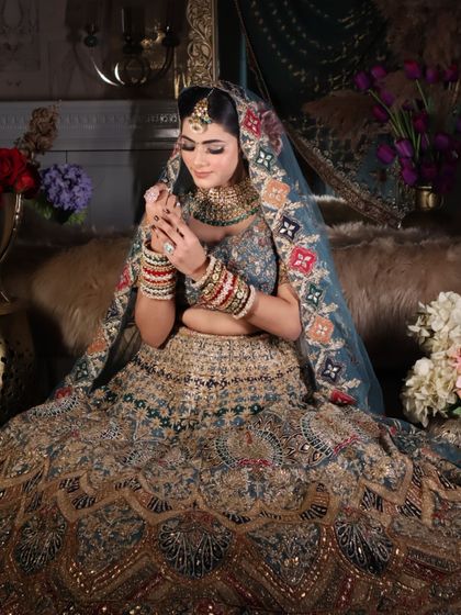 A candid moment of the bride playing with her bangles, a classic shot that feels natural and beautiful.