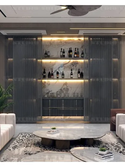 This drawing room in Kirti Nagar features a stunning bar area with fluted glass doors and backlighting, creating a focal point for entertainment.