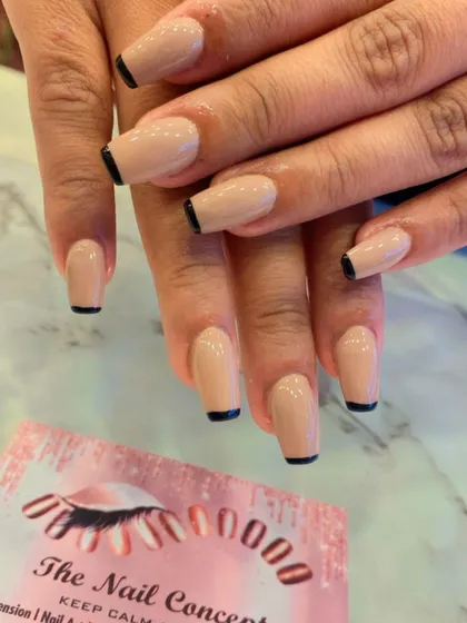 A duplicate of image 85, showing a modern and minimalist French manicure with a nude base and a thin black line at the tips of square nails.