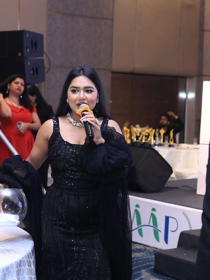 Managing a lucky draw segment at the Housiey gala. These moments of suspense and fun add another layer of excitement to the evening.