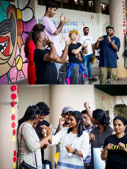 Volunteers and participants interacting and learning from each other at Sign Fest. The event includes games and activities designed to make learning Indian Sign Language fun and interactive.