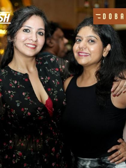 Two friends enjoying the music and the moment at Dobaraa.